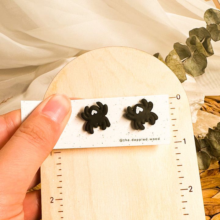 Black spider Halloween stud earrings with sculpted spooky-season details
