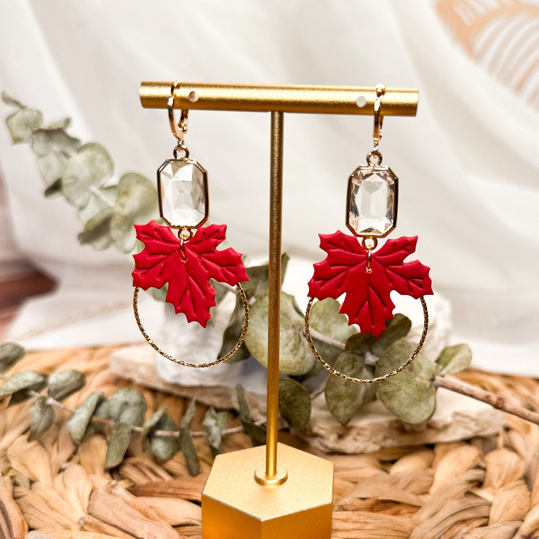 Lucinda sculpted red maple leaf earrings with clear faceted glass gems and gold hoops