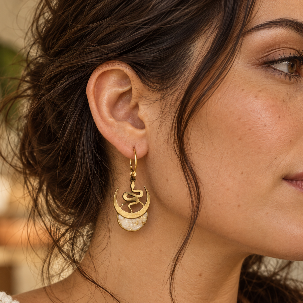 Model wearing Selene snake and moon earrings with Ivory Coast faux stone moons