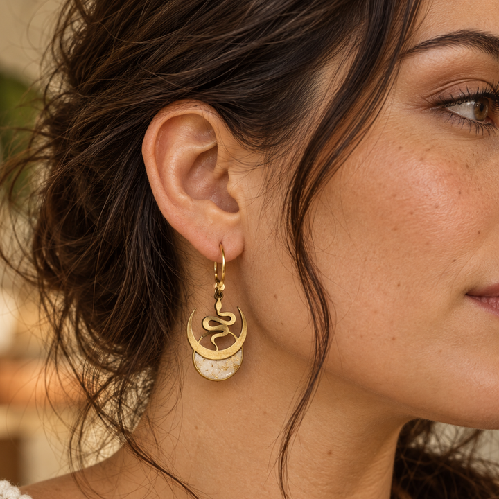 Model wearing Selene snake and moon earrings with Ivory Coast faux stone moons