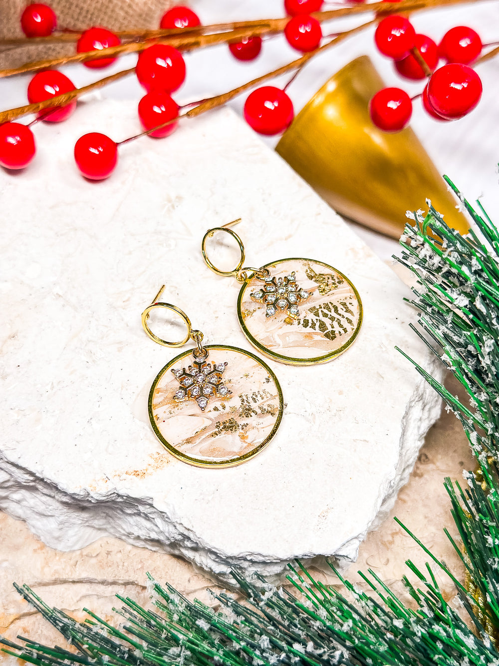 The Dappled Wood Holly Jolly framed circle earrings, featuring a CZ snowflake on a gold hollow circle post for a refined festive touch.