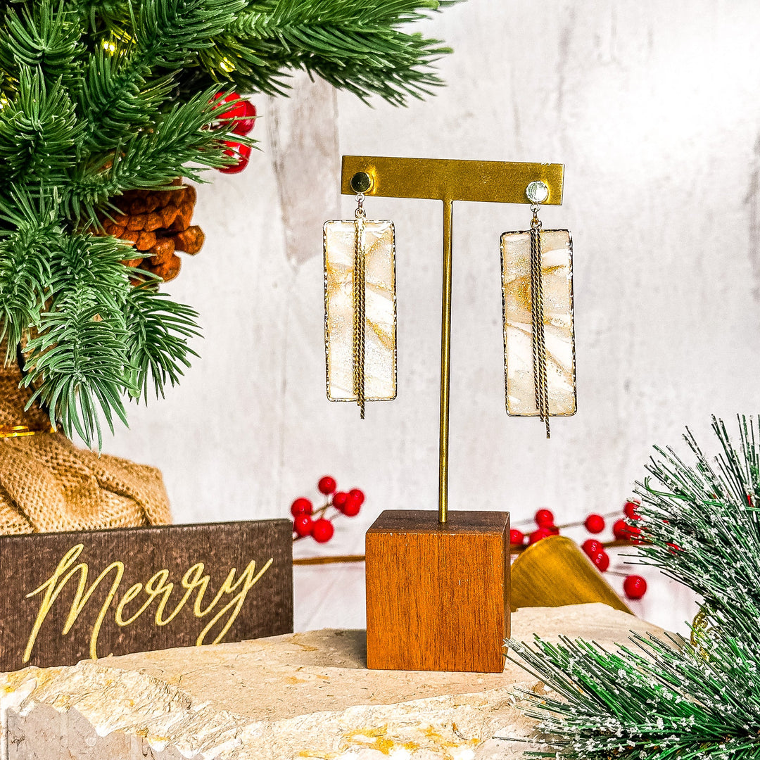The Dappled Wood Ivory Coast faux stone rectangle earrings with a framed circle post.