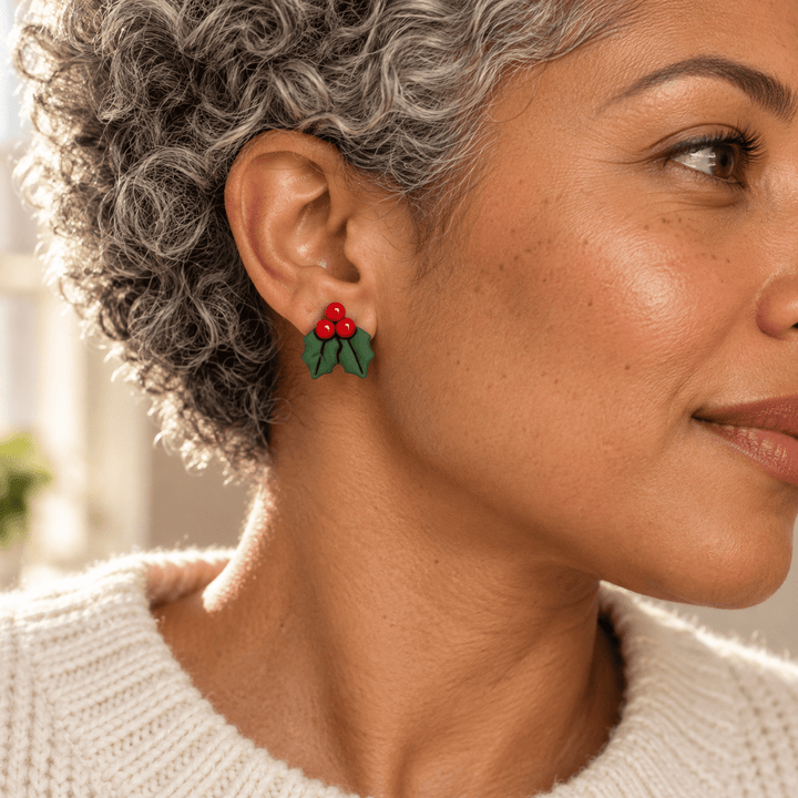 AI-generated styling preview of Agnes holly studs on a model with brown skin and silver curls; scale illustrative.