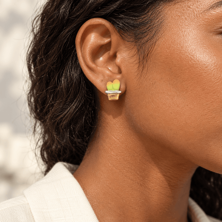 AI-generated styling preview of Ari potted cactus studs; scale is illustrative
