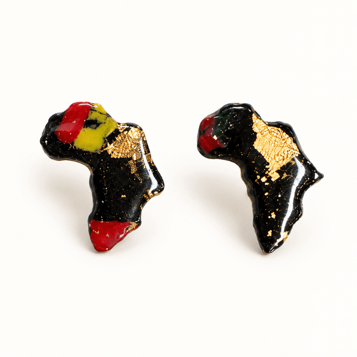 Ayana Africa-shaped clay stud earrings, Pan-African with Gold Leaf variant on white.