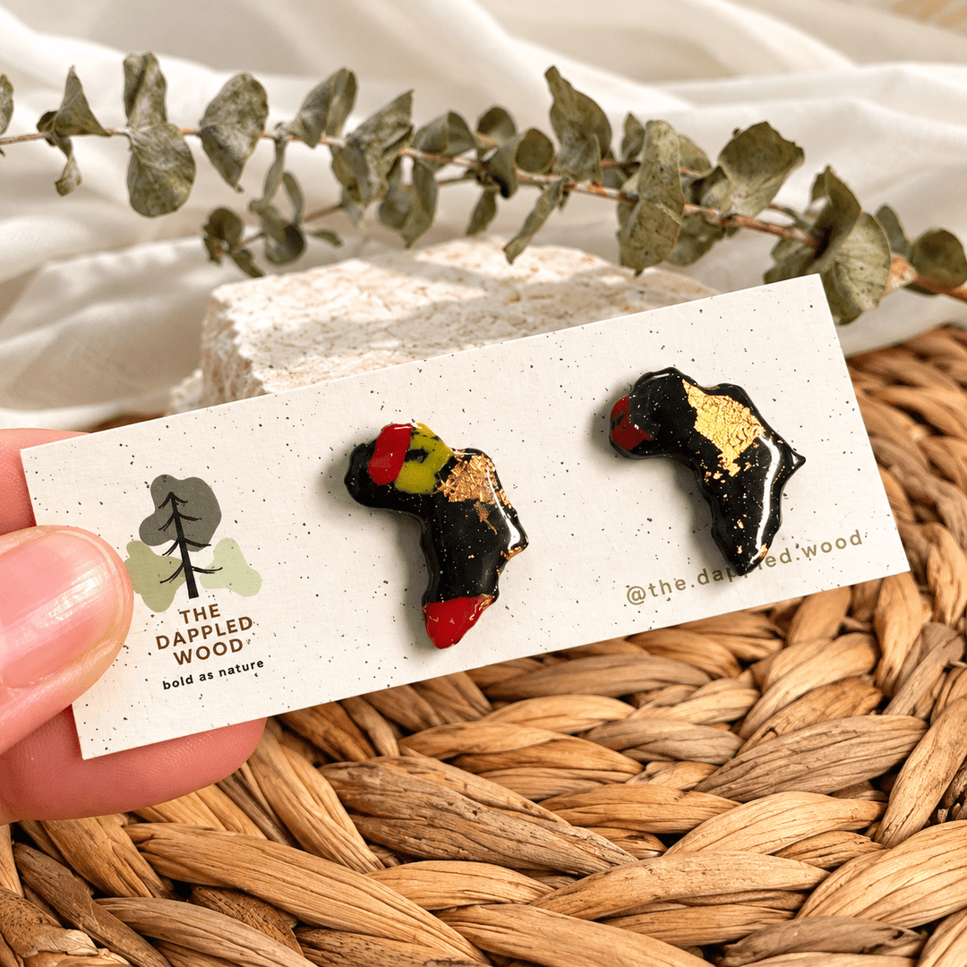 Ayana mini Africa stud earrings, Pan-African with Gold Leaf variant on a display card.