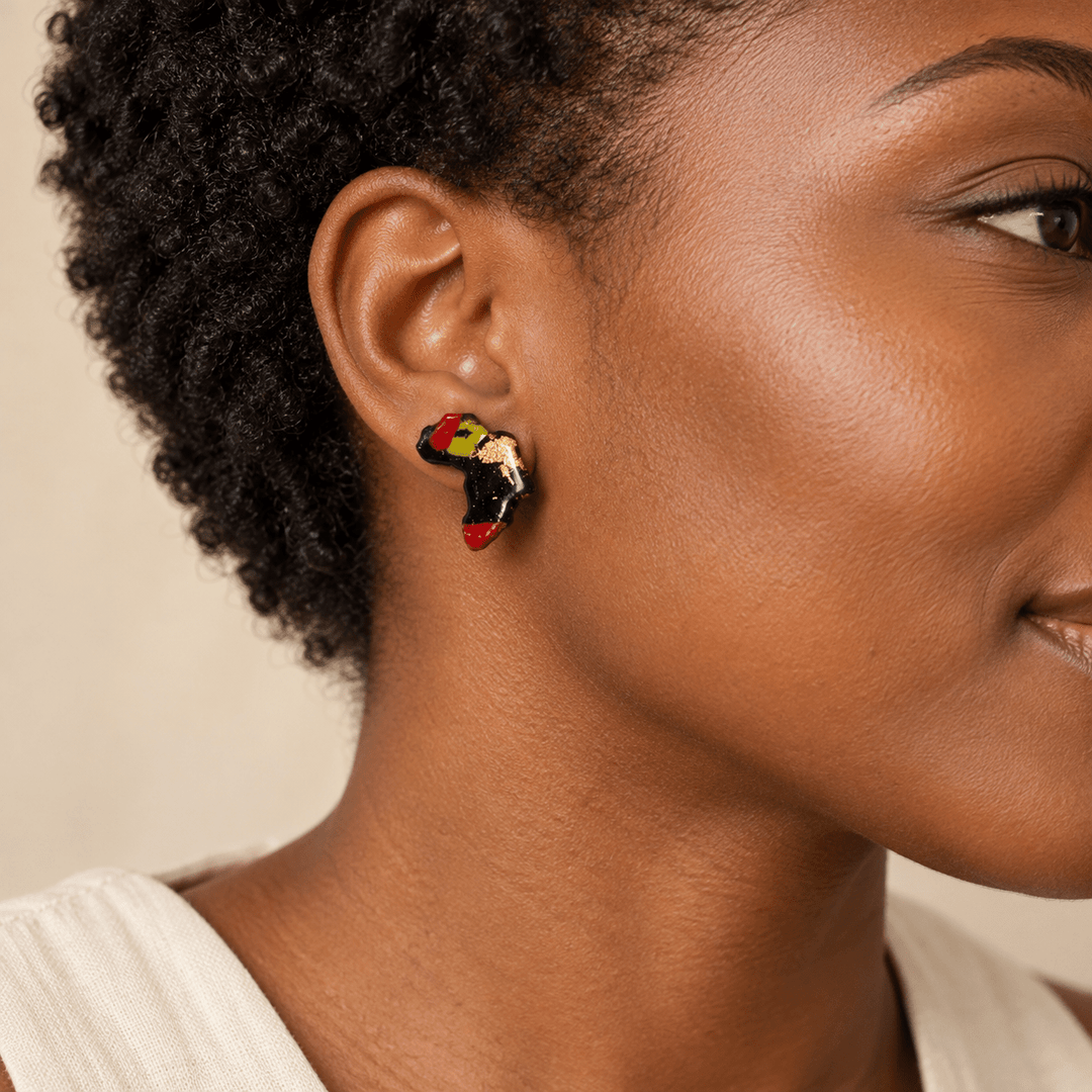 AI-generated styling preview of Ayana Pan-African with Gold Leaf Africa studs on a model with natural coils; scale illustrative.