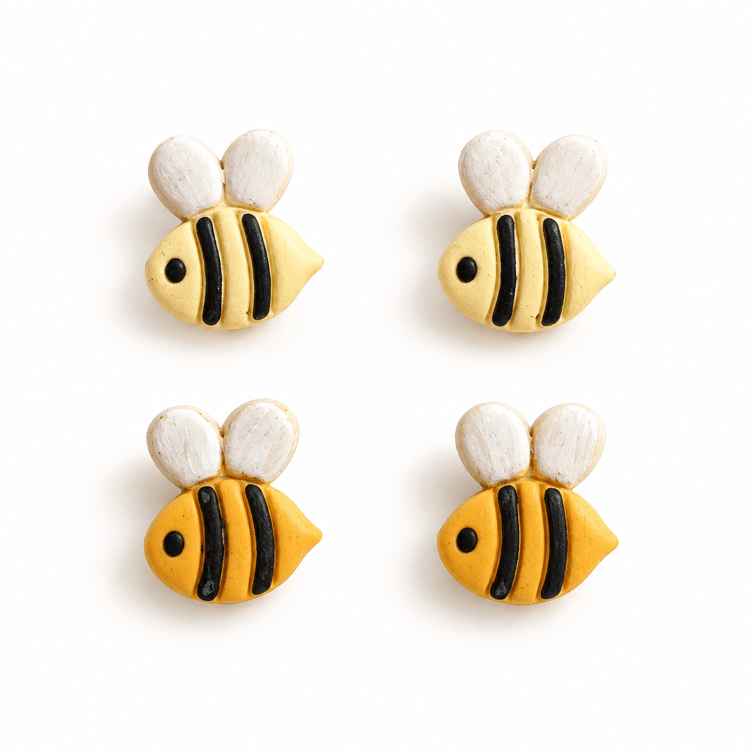 Beatrix bee stud earrings in Pastel Yellow and Golden Yellow with black stripes and white wings