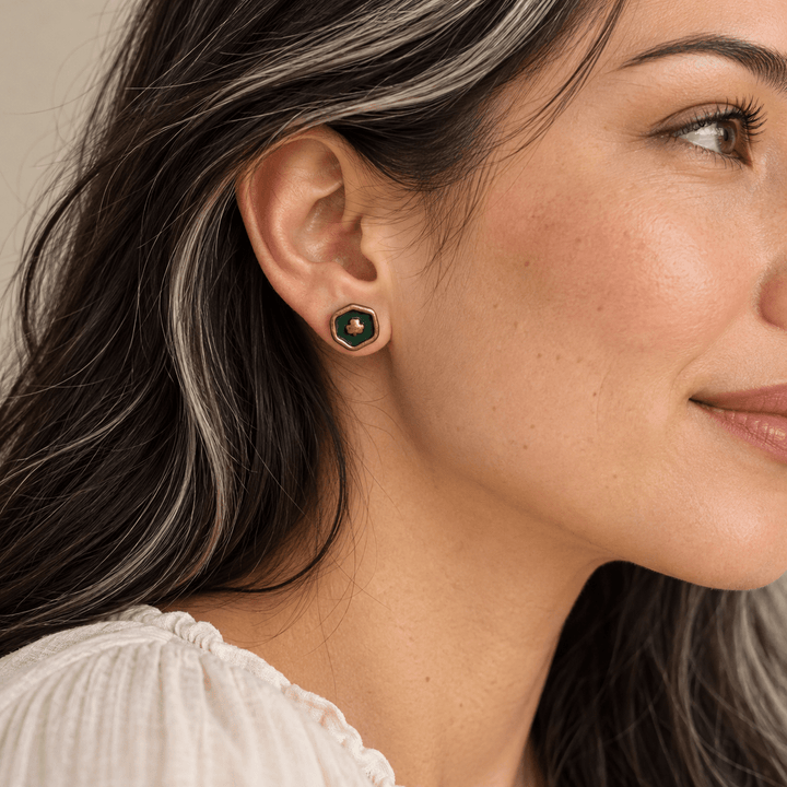 AI-generated styling preview of Felicity clover studs on a model with black hair and silver streaks; scale illustrative.