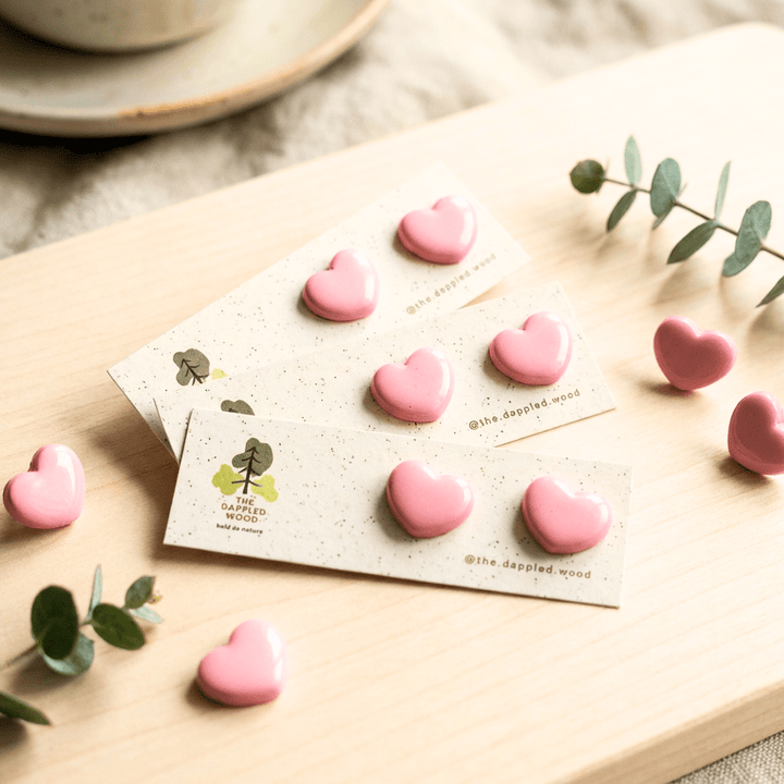 Cora - Small Puffy Heart Stud Earrings displayed in a product photo.