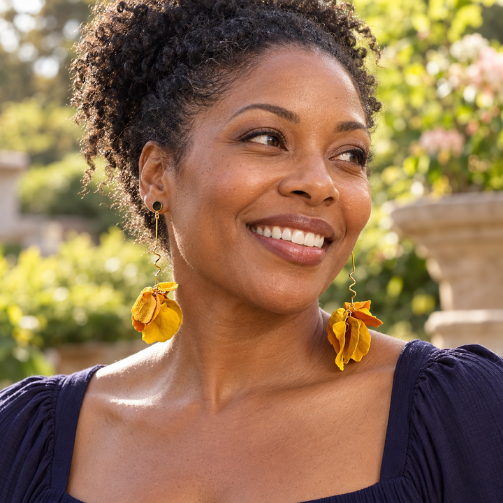 Woman wearing Delilah Yay for Yellow long petal drop earrings by The Dappled Wood.