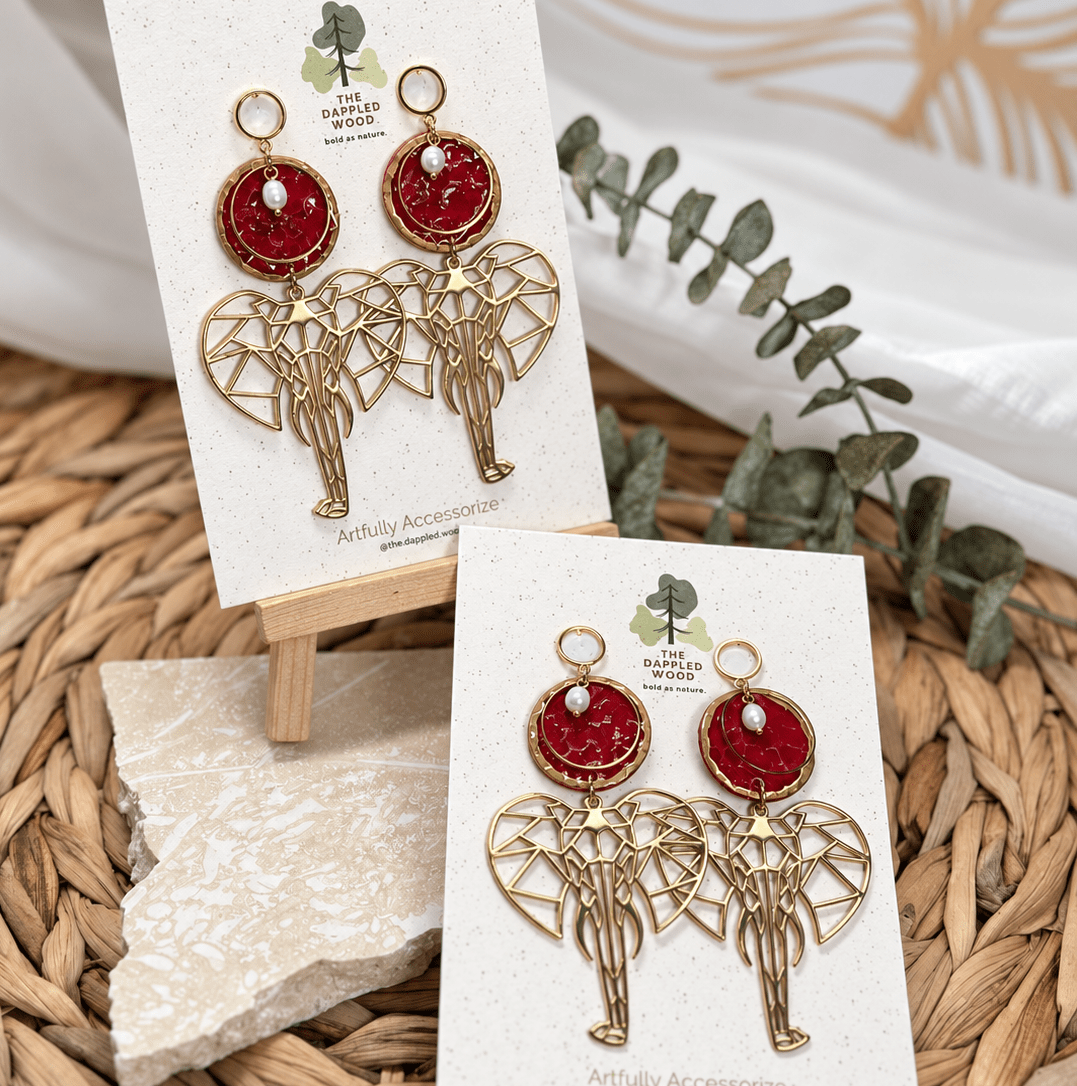 Dina red and gold elephant shoulder-duster earrings with pearl accents and open circle posts.
