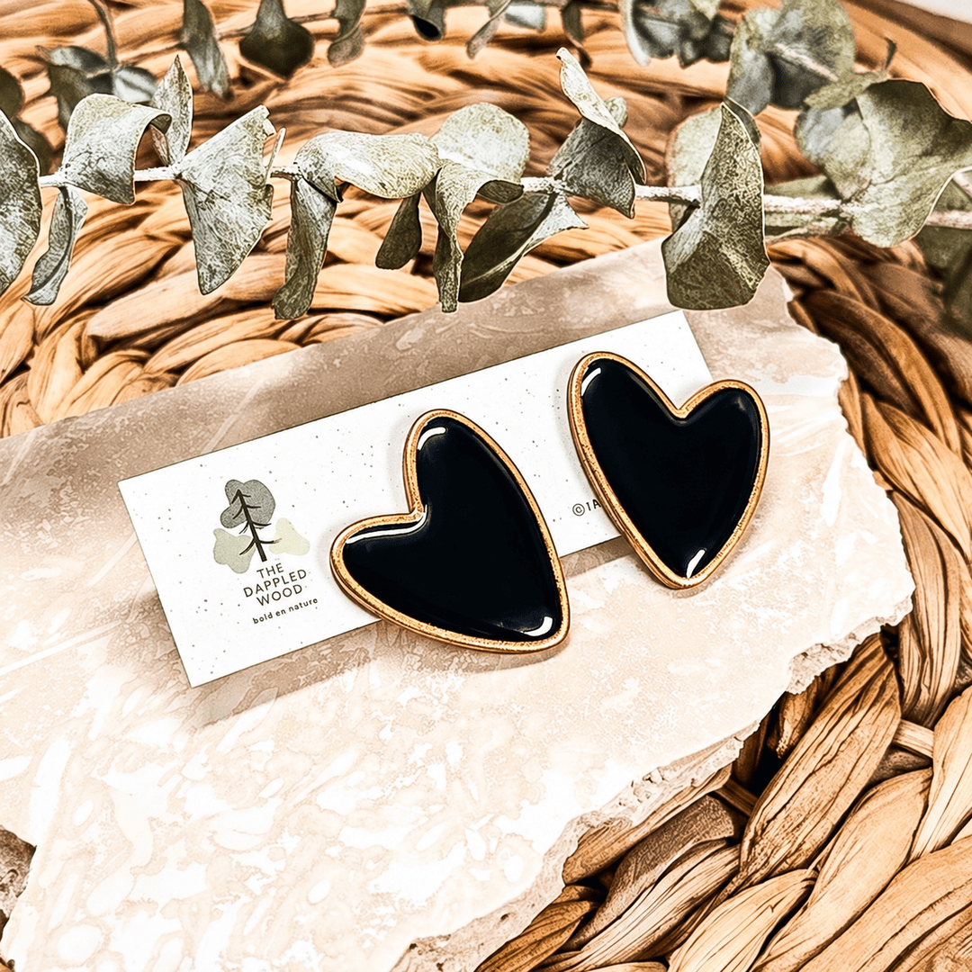 Black Dolly heart statement stud earrings with hand-painted gilded edges.
