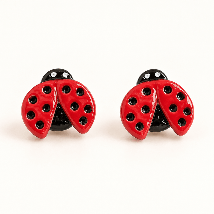 Dotty red ladybug stud earrings with recessed black spots and open wings