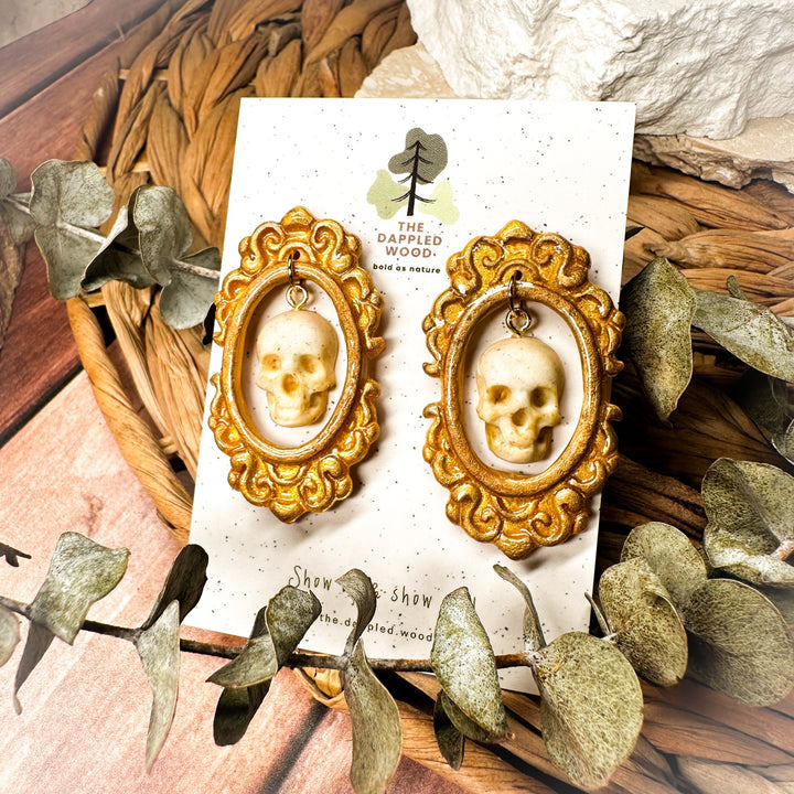 Drusilla handmade framed skull statement earrings in antique gold by The Dappled Wood