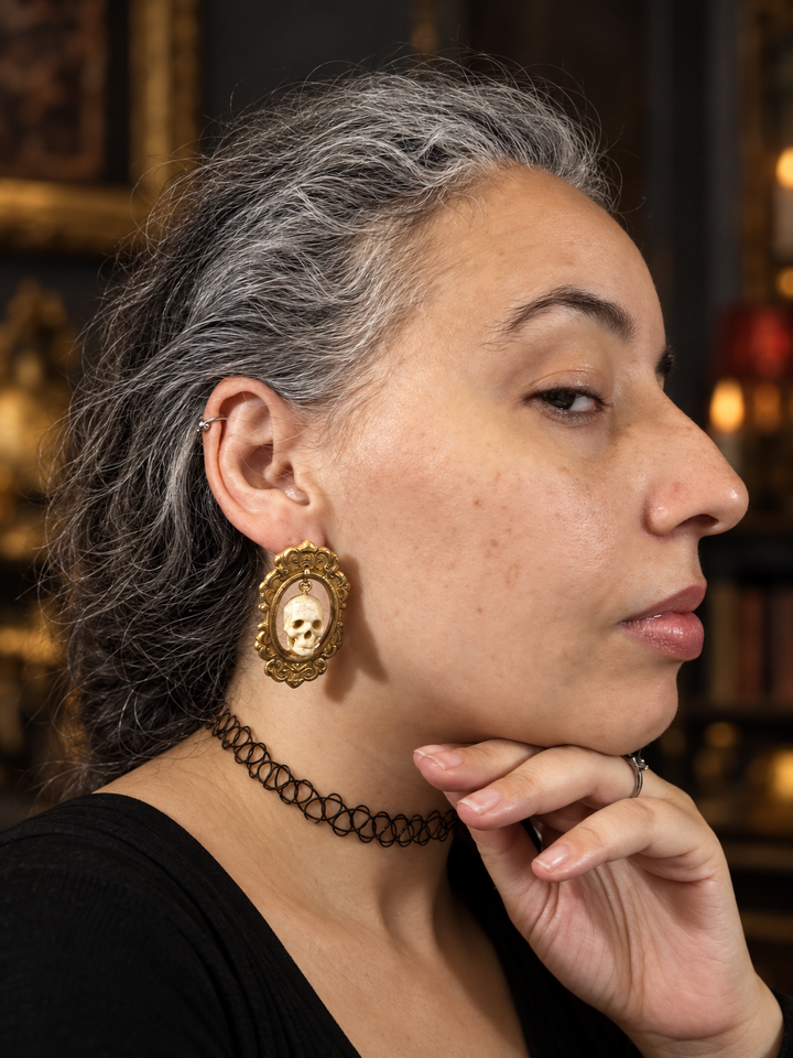 Profile view showing the scale of Drusilla Gothic skull statement earrings