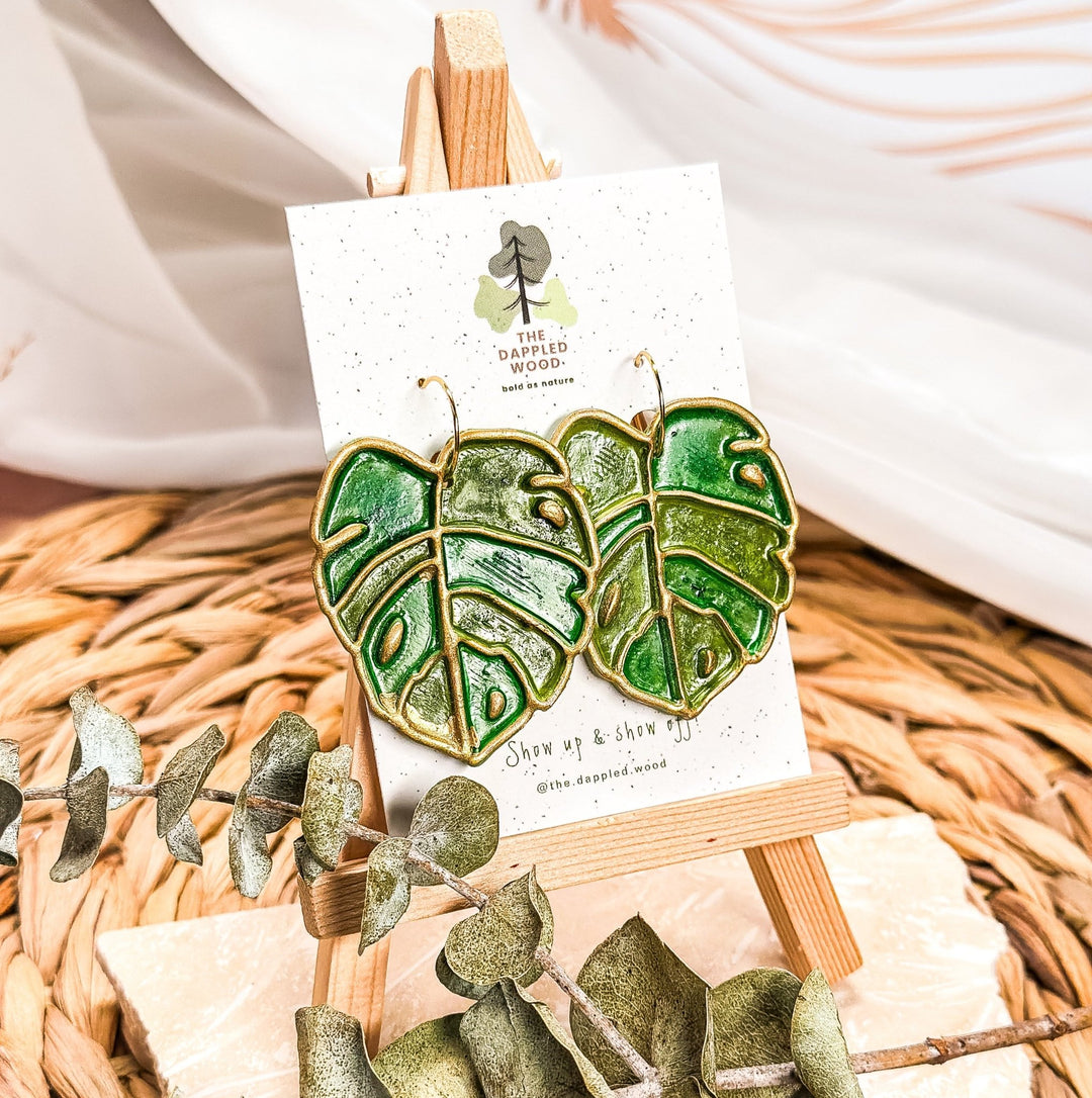 Eudora - Faux Stained Glass Monstera Earrings displayed in a product photo.