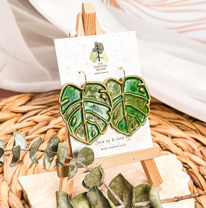 Eudora - Faux Stained Glass Monstera Earrings displayed in a product photo.