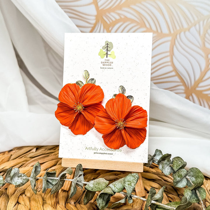 The Dappled Wood Fall 2025 Flora collection limited edition NuMomish tangelo flower earrings, bold handmade jewelry for women who love vibrant colors and statement accessories.