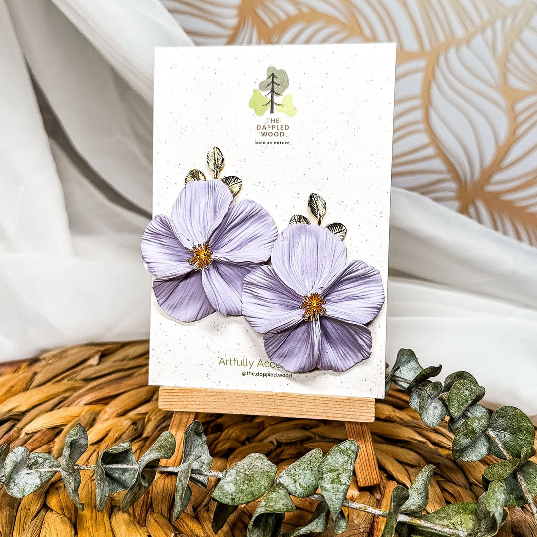 The Dappled Wood Fall 2025 Flora collection limited edition NuMomish lilac flower earrings, handmade statement jewelry for moms, everyday outfits, and unique artisan gifts.