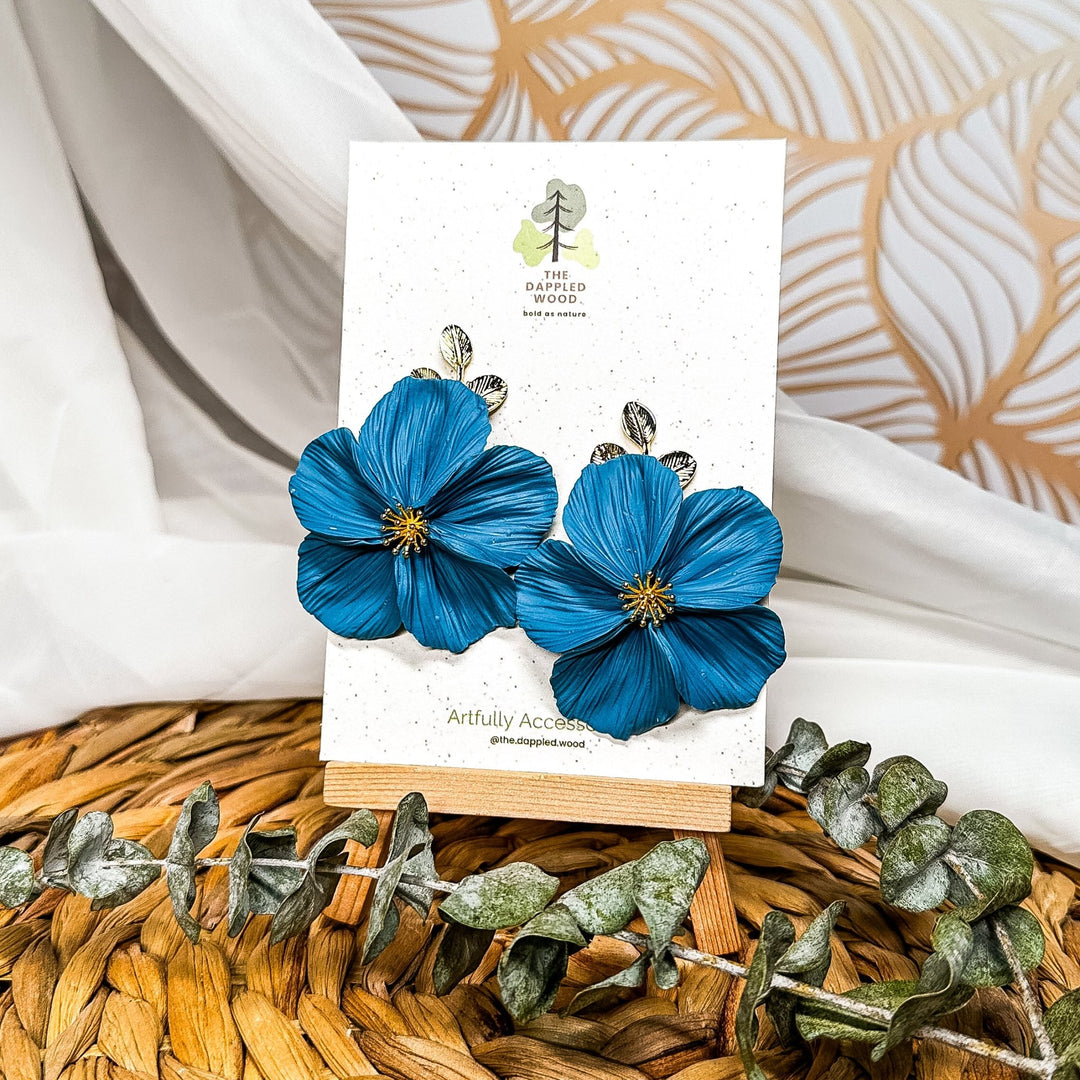The Dappled Wood Fall 2025 Flora collection limited edition Numomish teal flower earrings, handmade statement jewelry for moms, everyday outfits, and unique gifts.