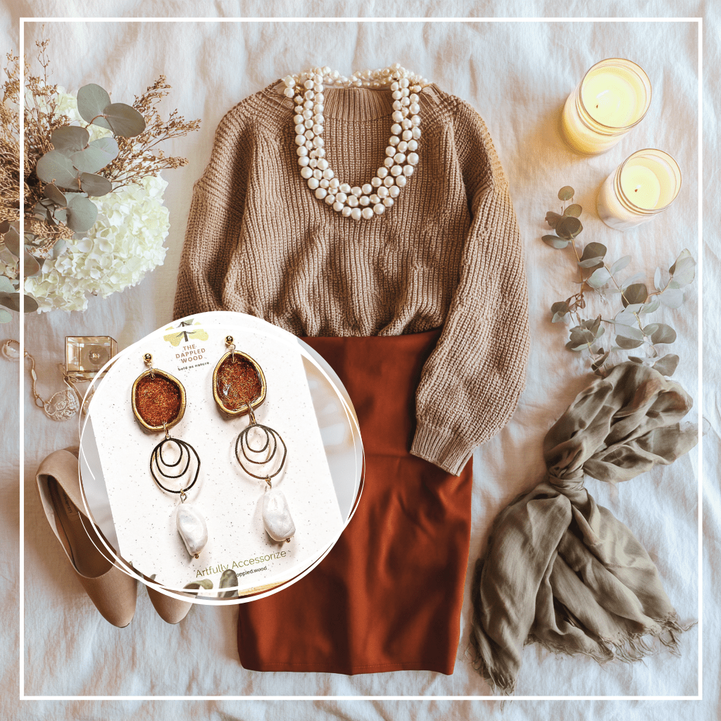 The Dappled Wood’s Rhea brick red and faux baroque pearl statement earrings styled with a brown sweater, brick red skirt, pearl necklace, scarf, candles, and flowers for a cozy Thanksgiving flatlay, Fall 2025