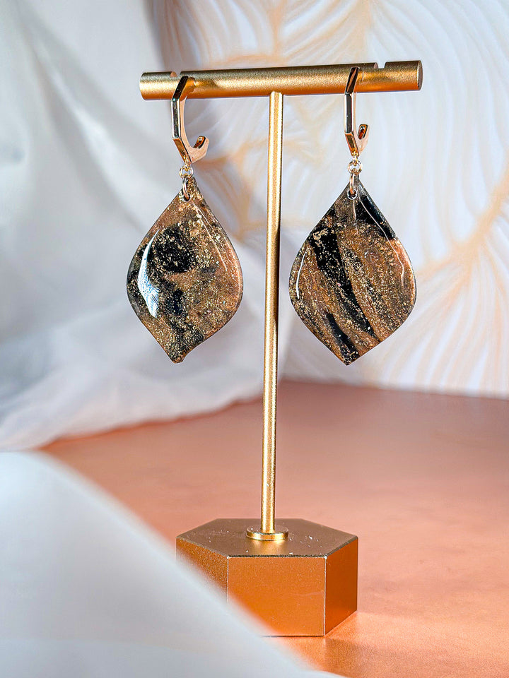 The Dappled Wood Molten Mirage soft diamond earrings with hexagon hoop posts, nature-inspired polymer clay jewelry.