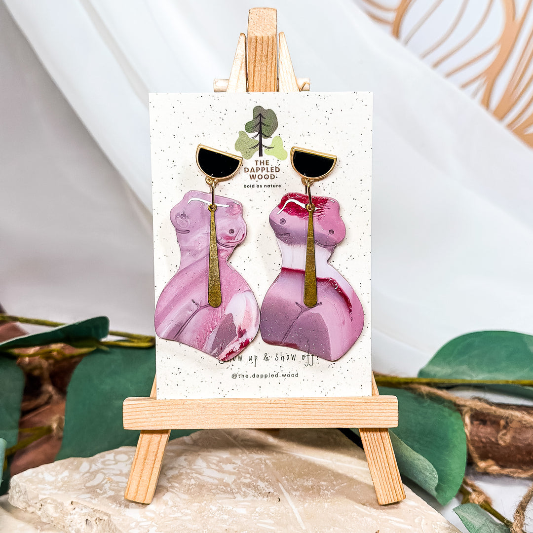 The Dappled Wood Nadia thick woman earrings from the Femininity Collection in mauve polymer clay, celebrating women’s curves with a bold statement design and lightweight comfort.