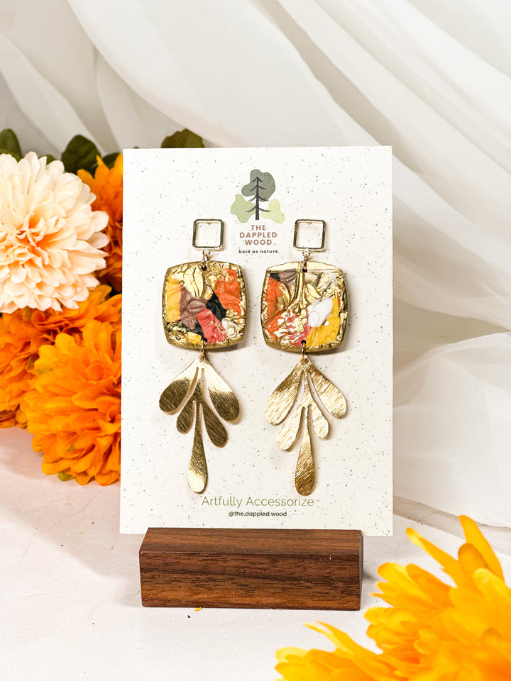 Gilded square earrings with a large brushed leaf charm, nature-inspired lightweight statement jewelry from The Dappled Wood.