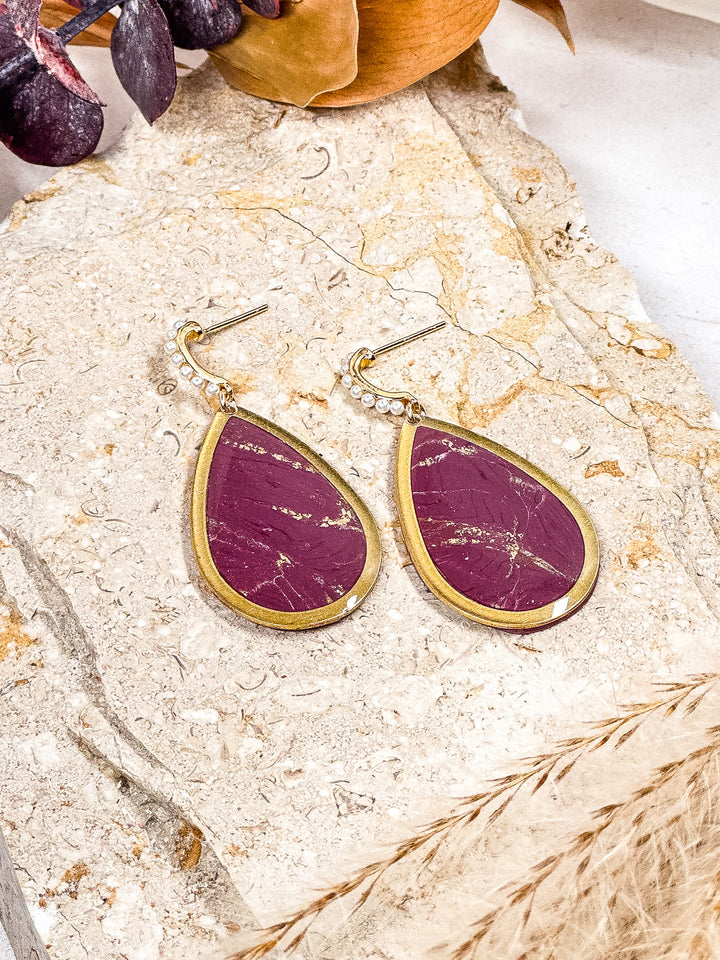 Plum teardrop earrings framed in gold with faux pearl posts, bold fall statement jewelry from The Dappled Wood.