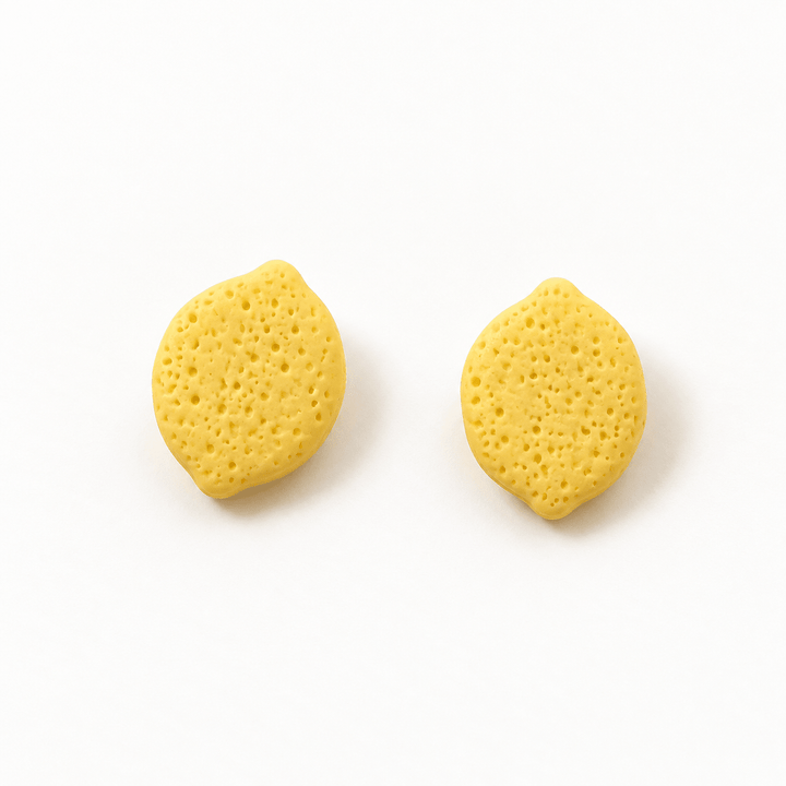 Leni yellow lemon stud earrings with textured rind and a matte finish