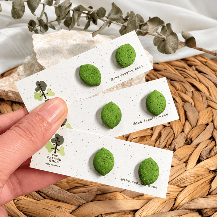 Three pairs of handmade Lula lime studs on The Dappled Wood display cards