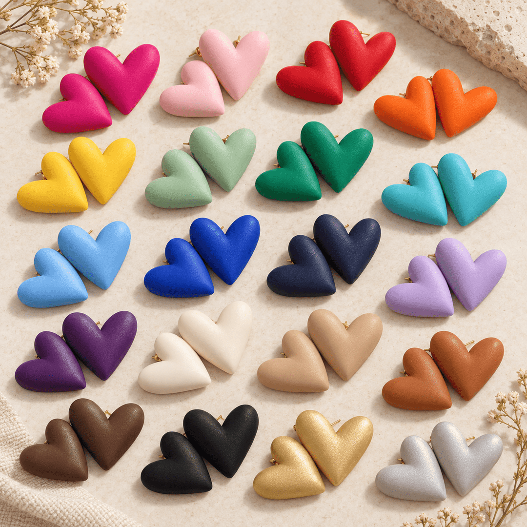 Mabel extra-large puffy heart earrings displayed in a wide assortment of colors.