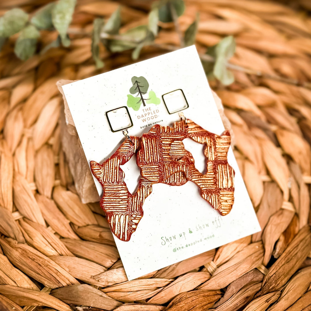Makena - Gold Africa Earrings displayed in a product photo.
