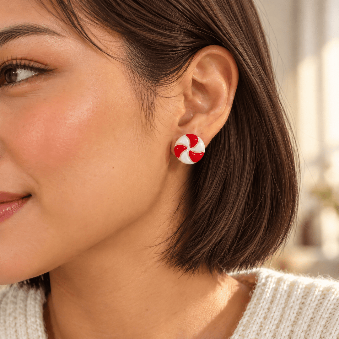 AI-generated styling preview of Merryn stud earrings on a model with natural brown hair; scale illustrative.
