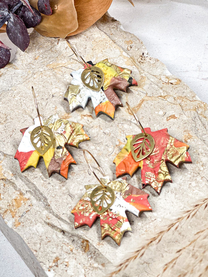 Multi-colored maple leaf earrings with a small leaf charm, fall-inspired lightweight statement jewelry by The Dappled Wood.