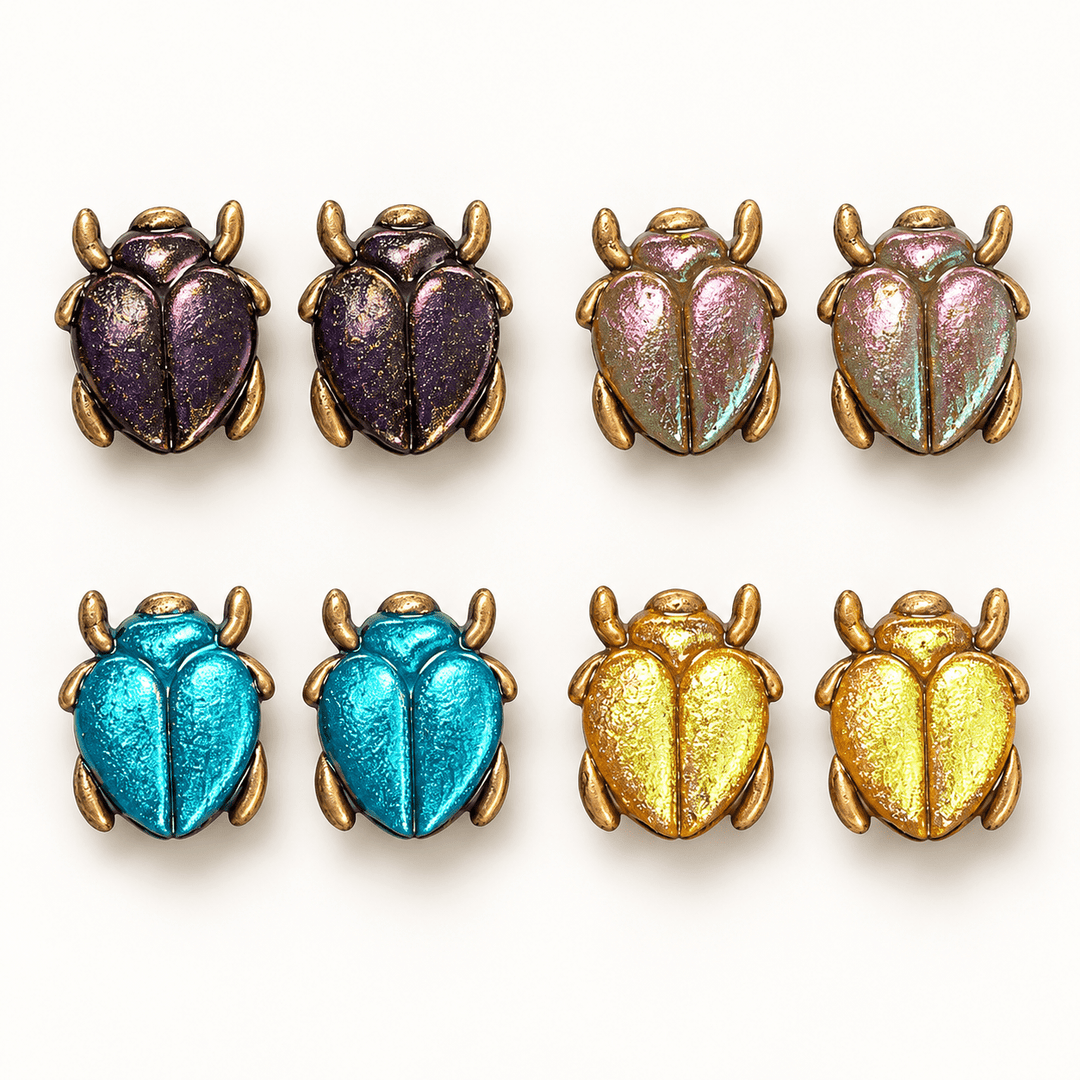 Saskia color-shift scarab beetle studs in Dark Plum, Sage Green, Caribbean Blue and Golden Yellow