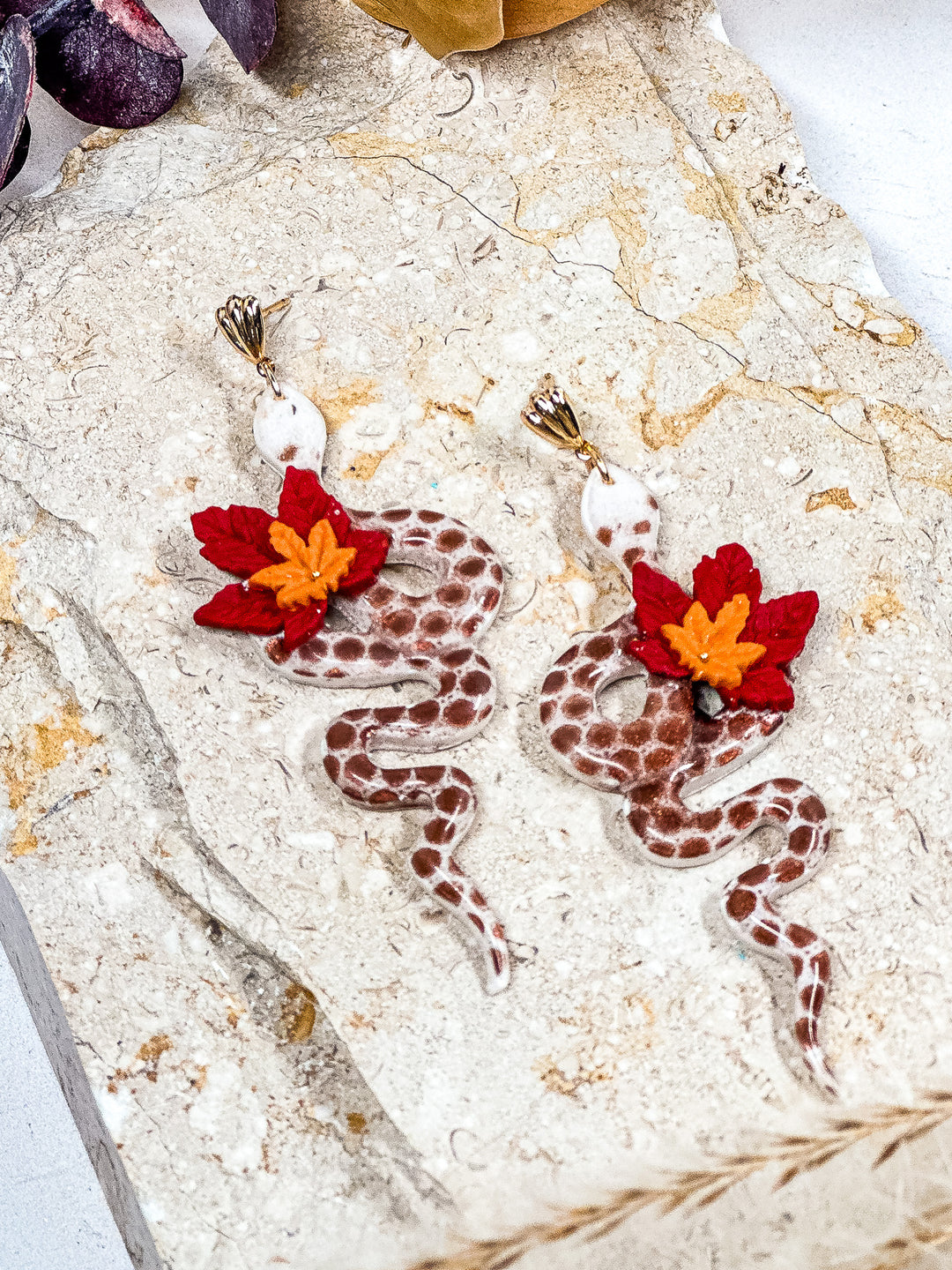 Snakelet earrings with a delicate maple leaf charm, handcrafted nature-inspired jewelry by The Dappled Wood.