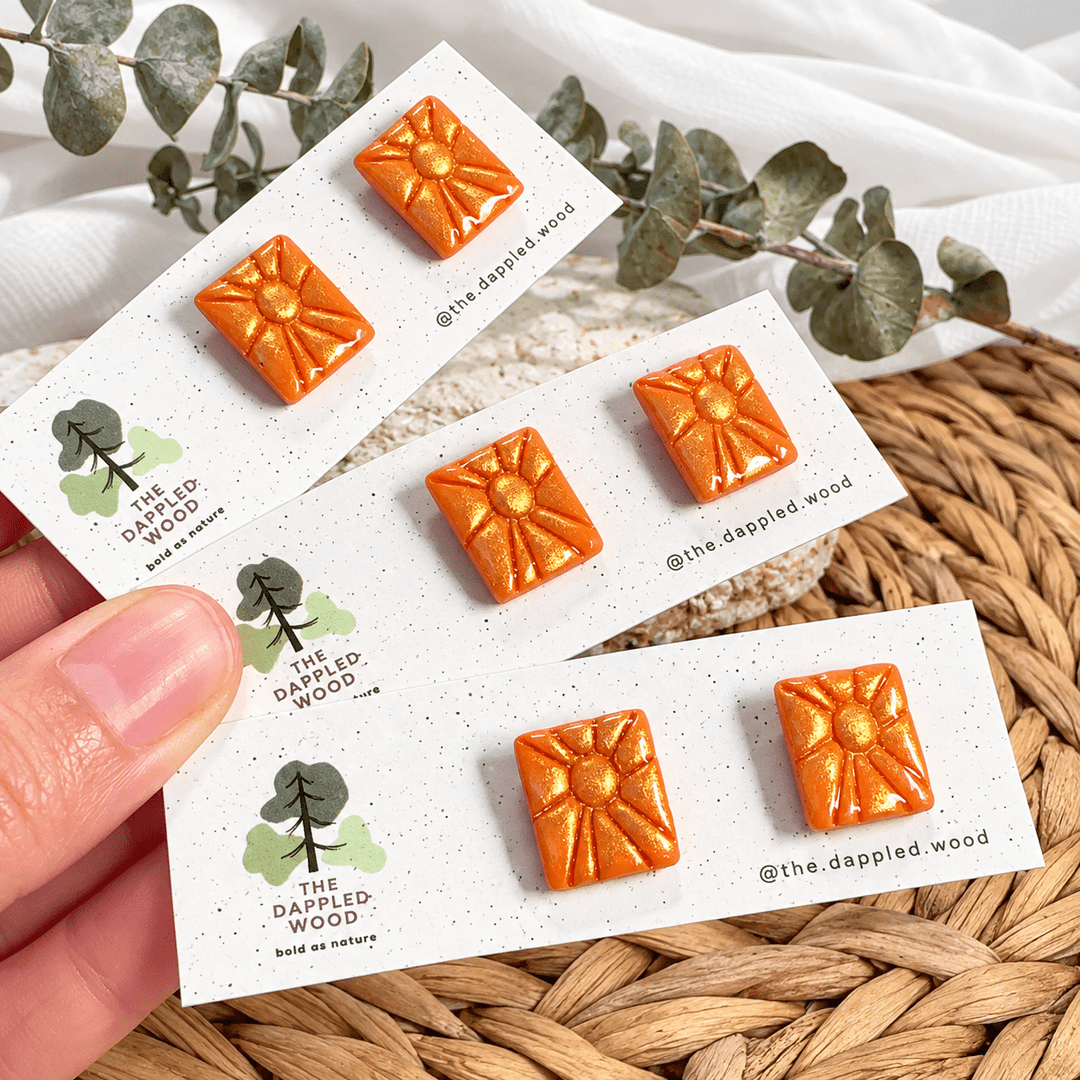 Handmade Soleil orange and gold sunburst studs on The Dappled Wood display cards