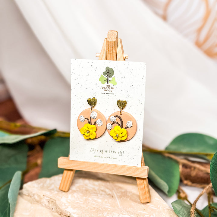 The Dappled Wood whimsical floral polymer clay earrings from the Spring 2024 collection, featuring a lightweight design for sensitive ears.