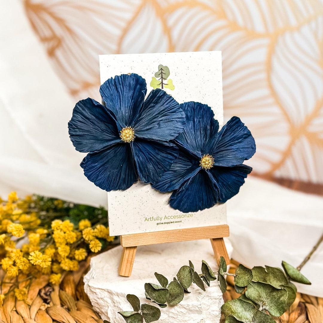 The Dappled Wood's Sabine polymer clay flower earrings in Midnight feature an inky black to navy blue gradient. Bold floral clay earrings and lightweight statement jewelry, perfect for evening events or elegant galas.