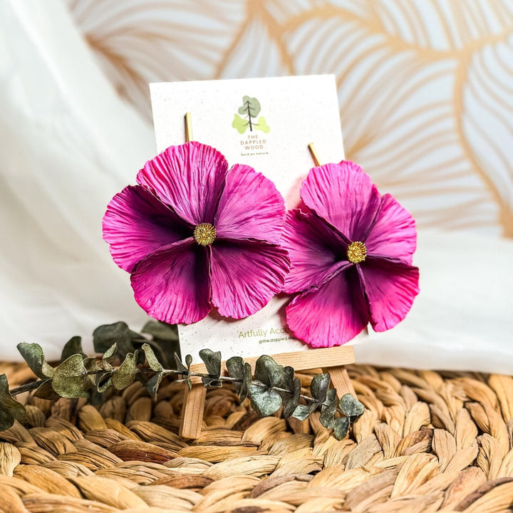 The Dappled Wood's Sabine polymer clay flower earrings in Orchid feature a bright purple to pink gradient. Bold floral clay earrings and lightweight statement jewelry, perfect for garden weddings or spring brunches.