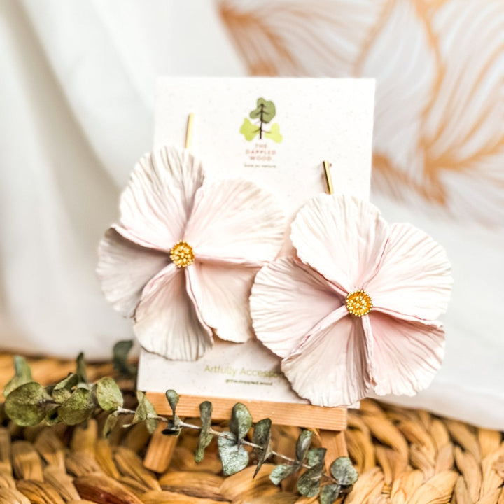 The Dappled Wood's Sabine polymer clay flower earrings in Rosé feature a pale pink to white gradient. Bold floral clay earrings and lightweight statement jewelry, perfect for spring weddings or baby showers.