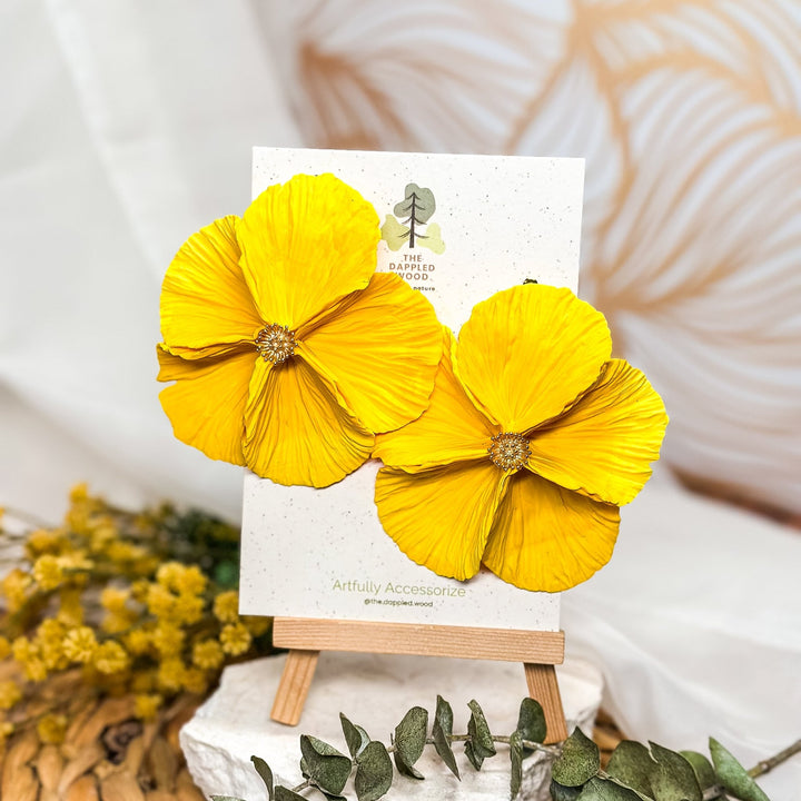 The Dappled Wood's Sabine polymer clay flower earrings in Sunshine feature a rich golden yellow gradient. Bold floral clay earrings and lightweight statement jewelry, perfect for summer festivals or daytime picnics.