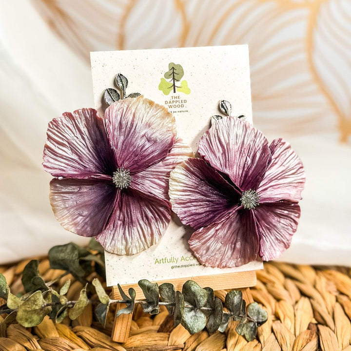 The Dappled Wood's Sabine polymer clay flower earrings in Wisteria feature a plum to pearl white gradient. Bold floral clay earrings and lightweight statement jewelry, perfect for winter weddings or holiday dinners.
