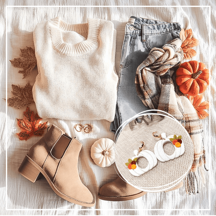 Pumpkin patch outfit inspiration featuring the Sylvia pumpkin earrings from The Dappled Wood. White pumpkin hoop earrings highlighted over a flatlay with a cream sweater, jeans, plaid scarf, ankle boots, pumpkins, and fall leaves.