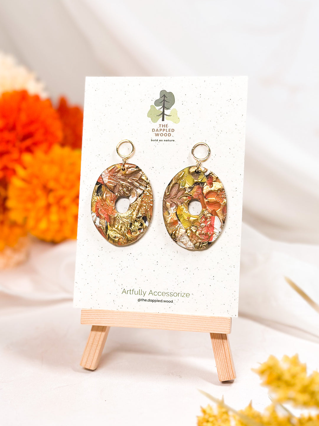 Thick donut-shaped earrings with a hollow center, modern lightweight polymer clay jewelry from The Dappled Wood.