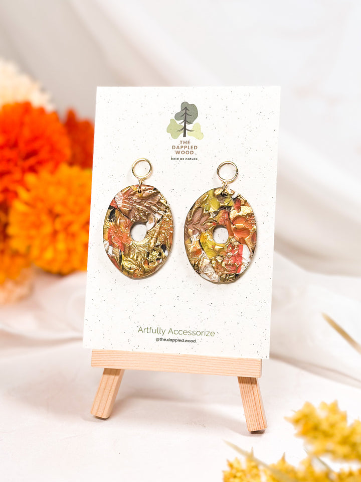 Thick donut-shaped earrings with a hollow center, modern lightweight polymer clay jewelry from The Dappled Wood.