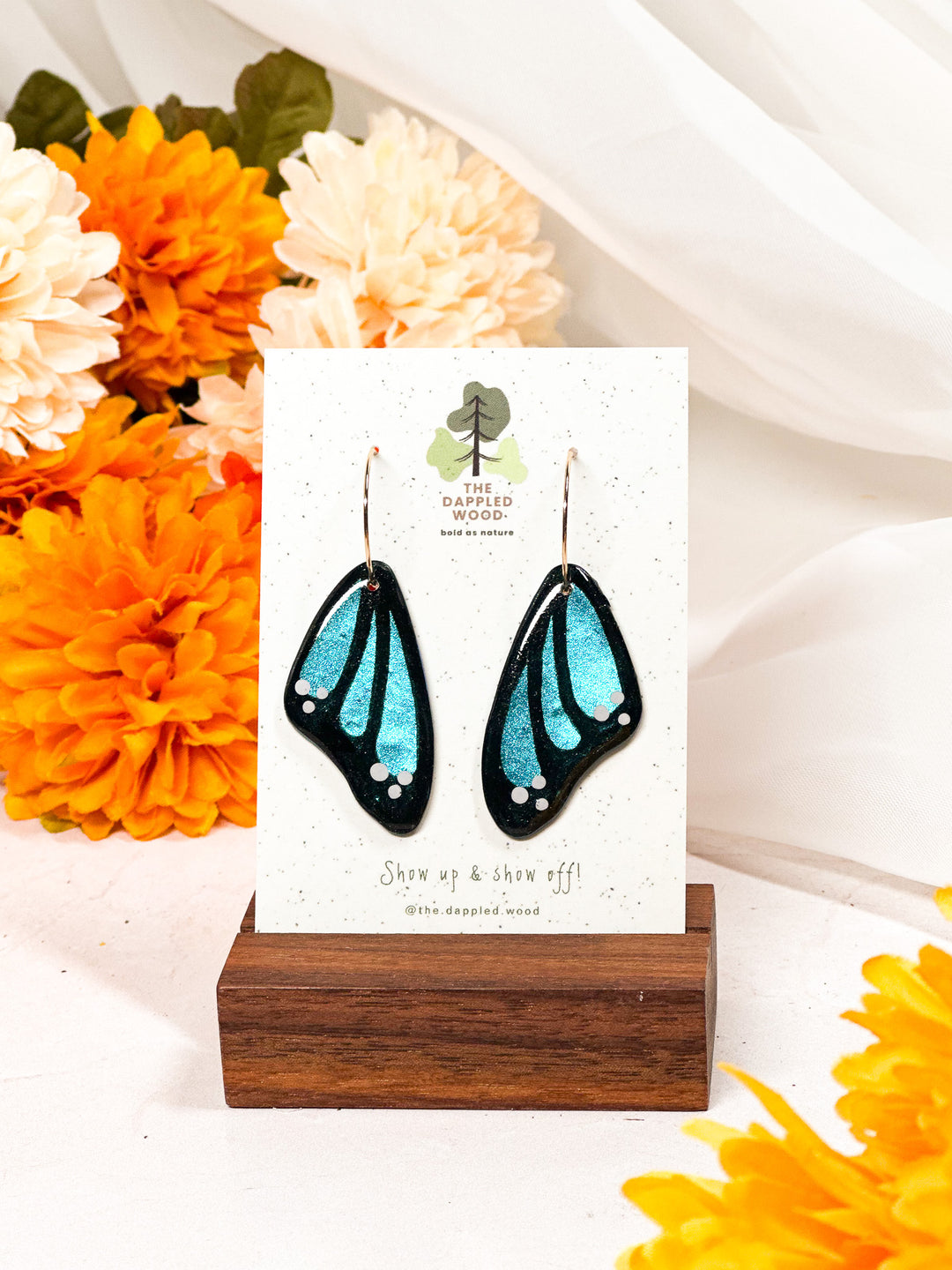 Blue butterfly wing earrings from The Dappled Wood, handmade lightweight statement jewelry designed for all-day wear.