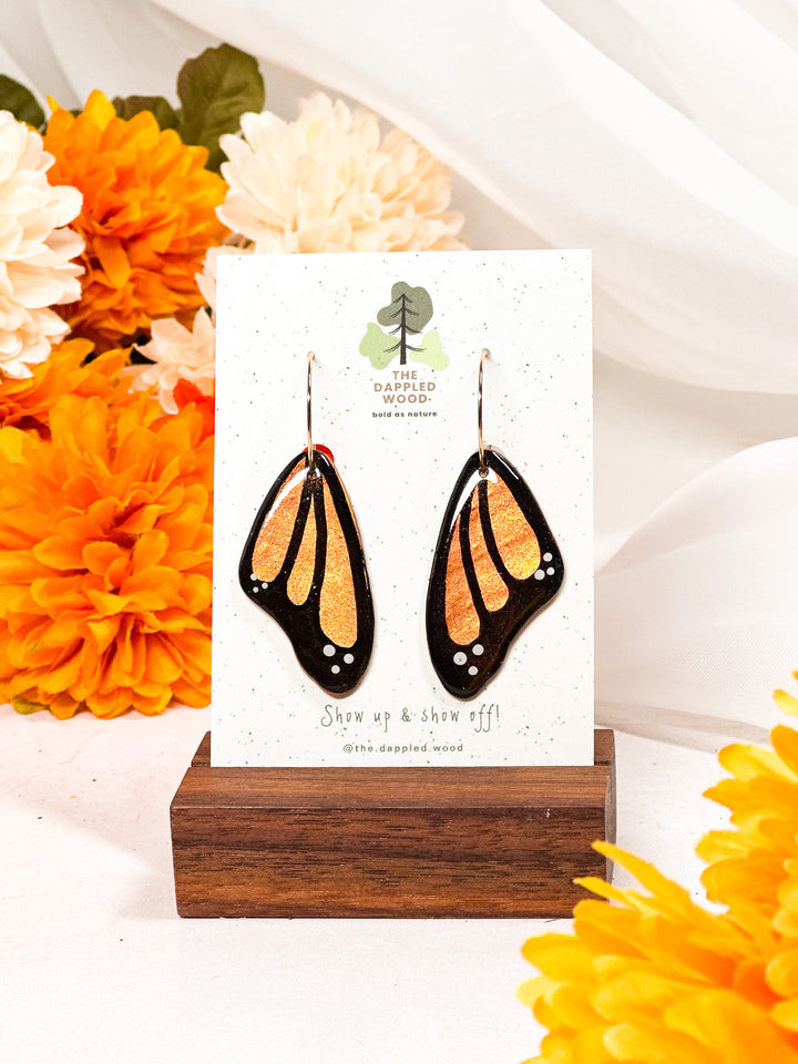 Orange butterfly wing earrings from The Dappled Wood, handcrafted hypoallergenic jewelry perfect for bold nature-inspired style.